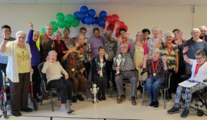 Senior living participants celebrating Motiview Road Worlds Championship