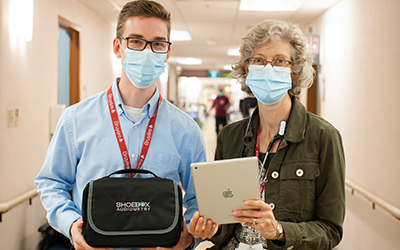 Blake Daly and Dr. Anne Harley holding the SHOEBOX Quicktest