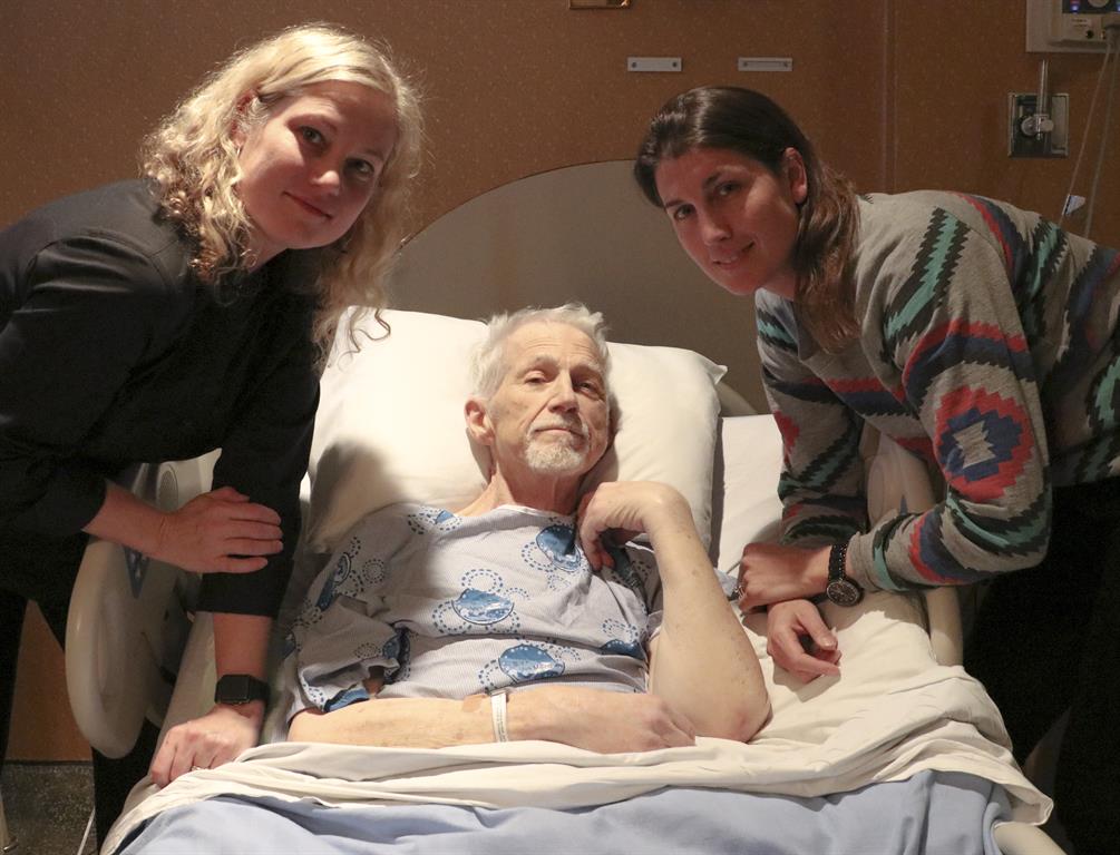 Laura, Karen and Chris Bradshaw in a hospital room